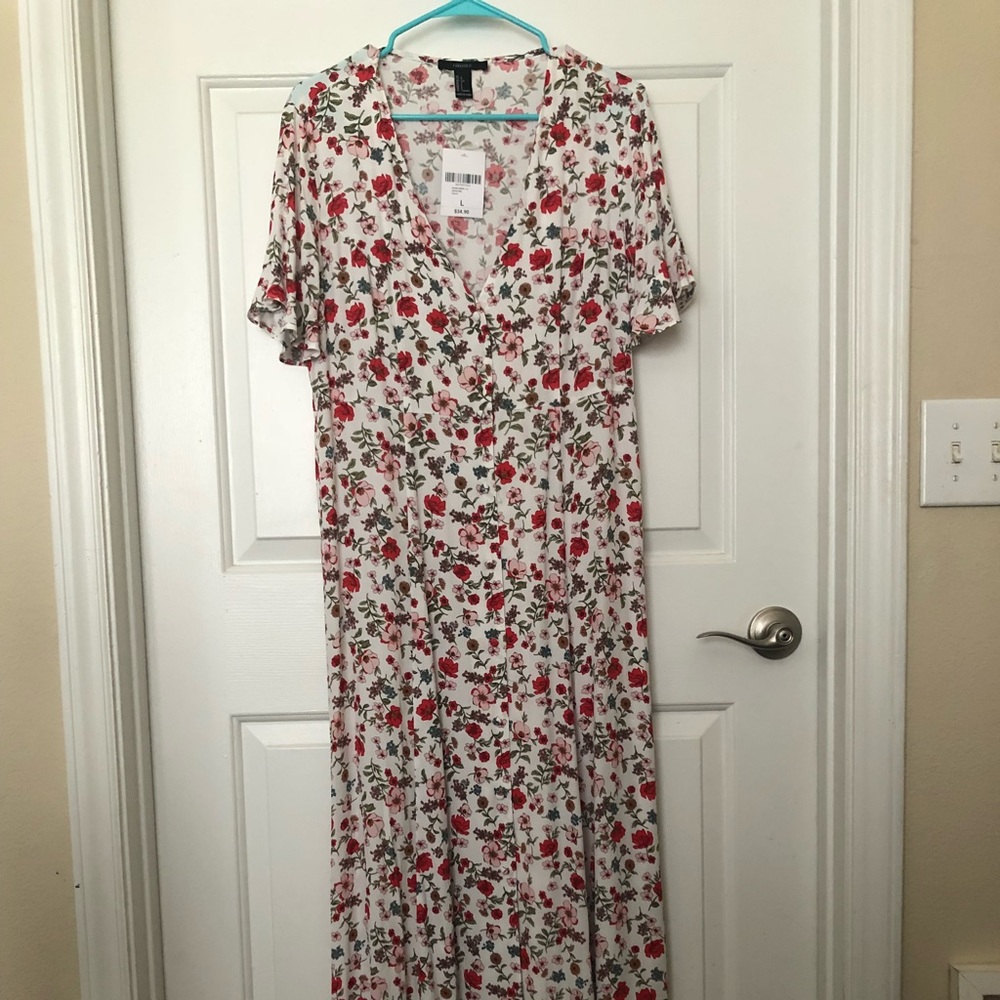 Floor length flowered dress.
